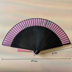 A foldable fan with Traditional Chinese Plum Blossom Painting on a white surface