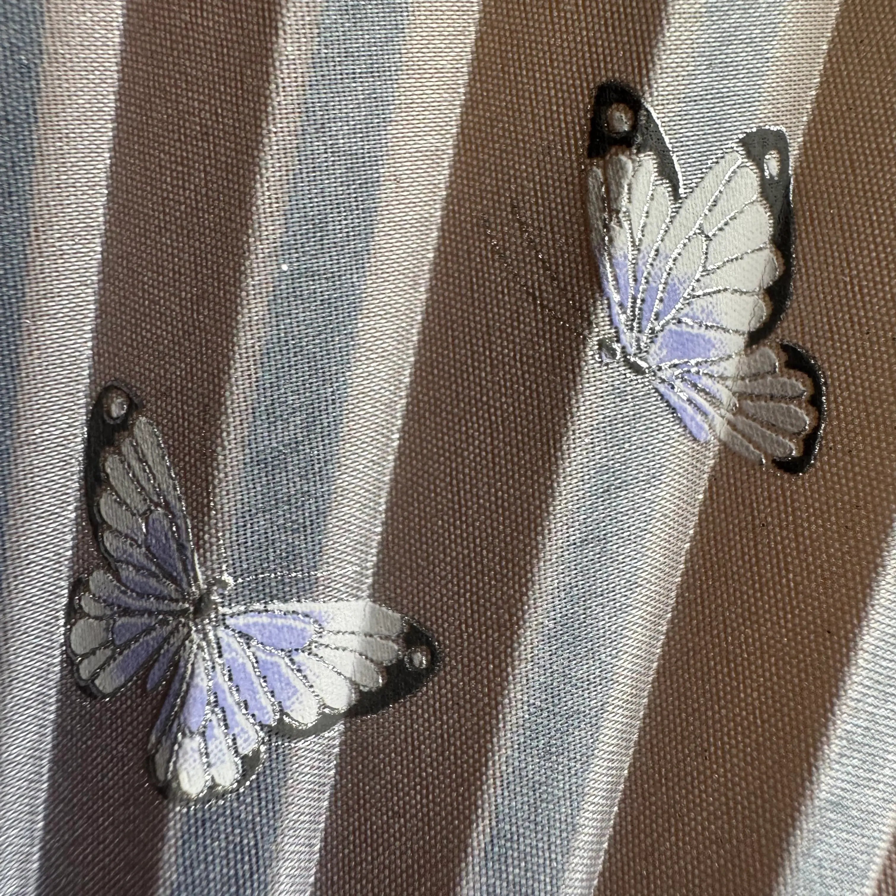 2 butterflies on the fan surface