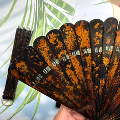 Details of the gold-sprinkled patterns of an East Asian lacquer folding fan (Urushi fan).