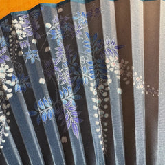 Details of a Chinese bamboo folding fan: beautiful wisteria patterns