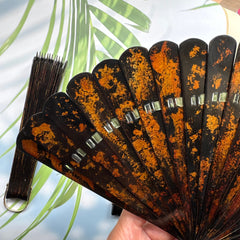 Details of the gold-sprinkled patterns of an East Asian lacquer folding fan (Urushi fan). 