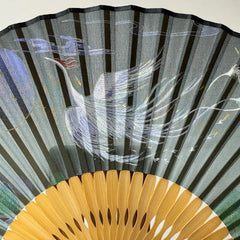 Details of the phoenix printed on a Chinese silk phoenix folding fan.