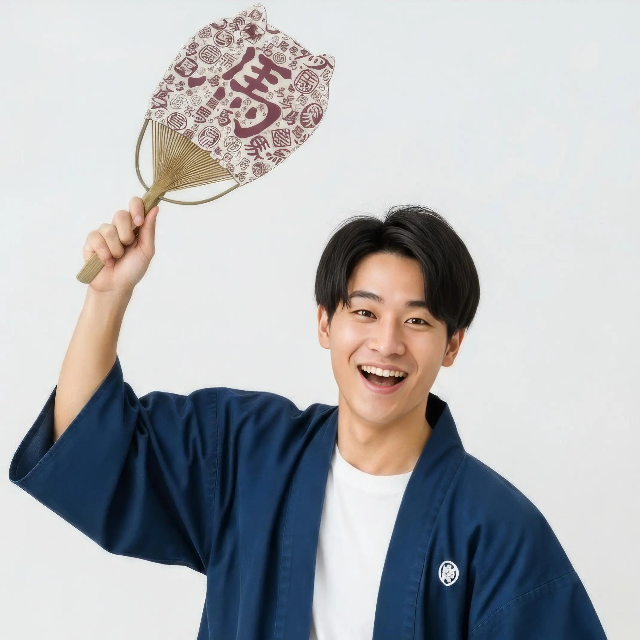 Japanese man smiling and holding up high a cat-eared uchiwa fan (Japanese round fan) covered in Chinese calligraphy of the character for "horse".