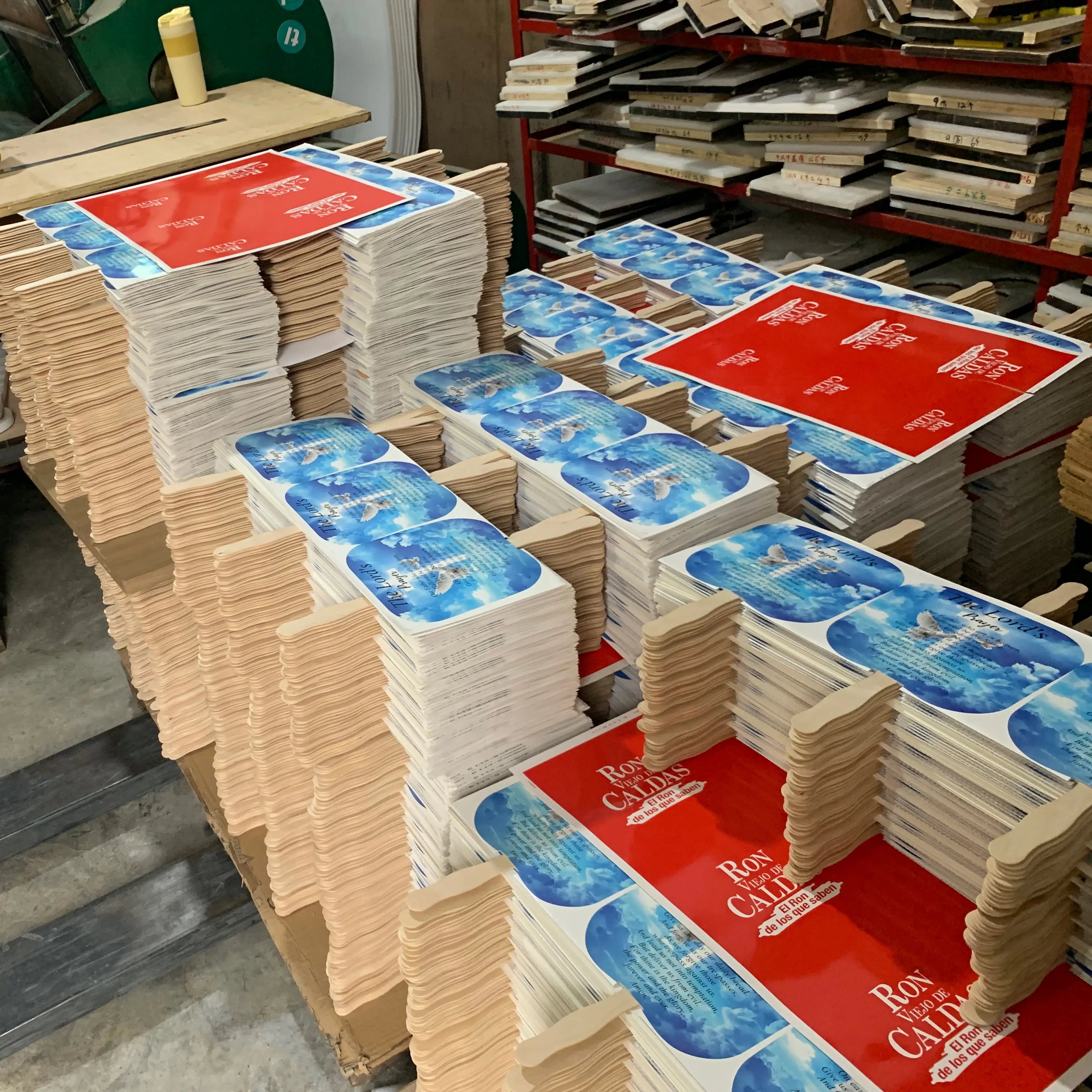 A large factory production run of thousands of custom printed paper fans featuring church-related designs, ideal for religious events and congregation giveaways.
