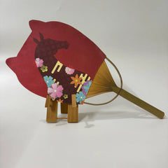 A Japanese round fan (Uchiwa fan) with cat ears. On the fan panel it prints horse picture.